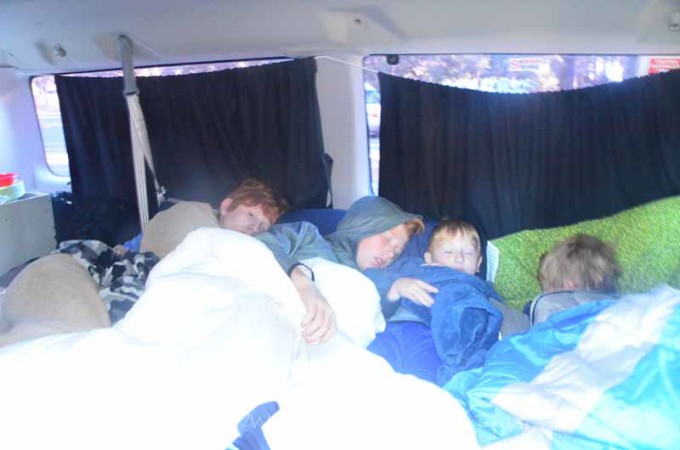 kids sleeping in a campervan